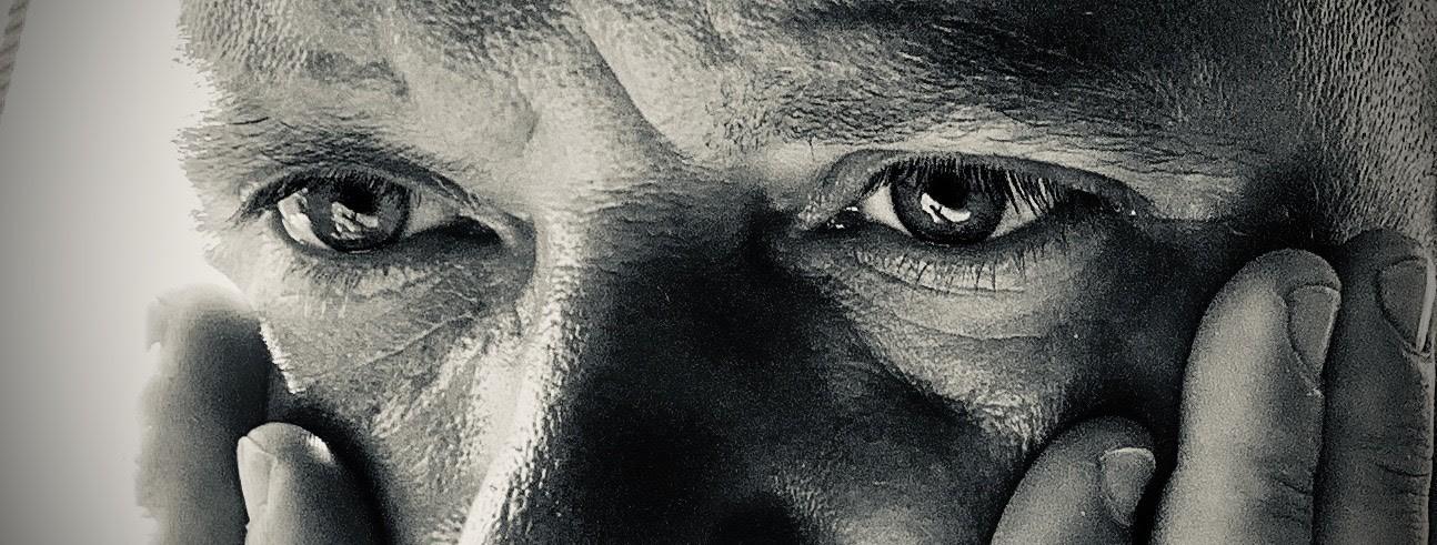 Close-up of a person's eyes and hands