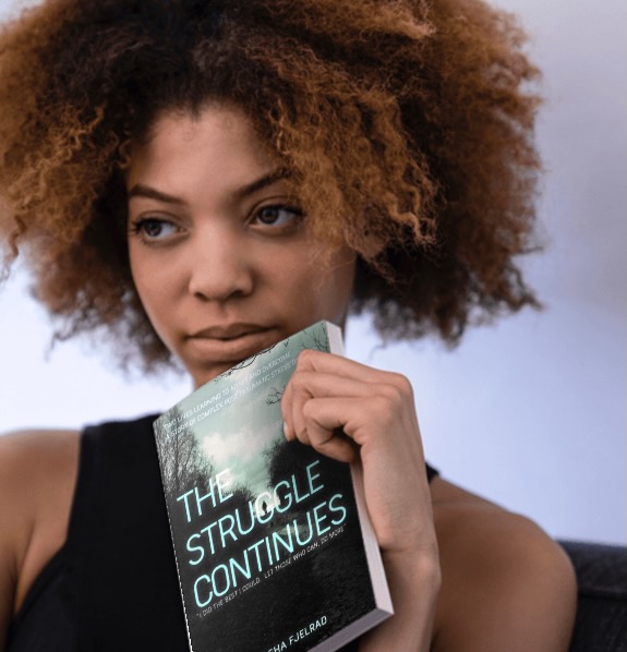 The paperback in hand
