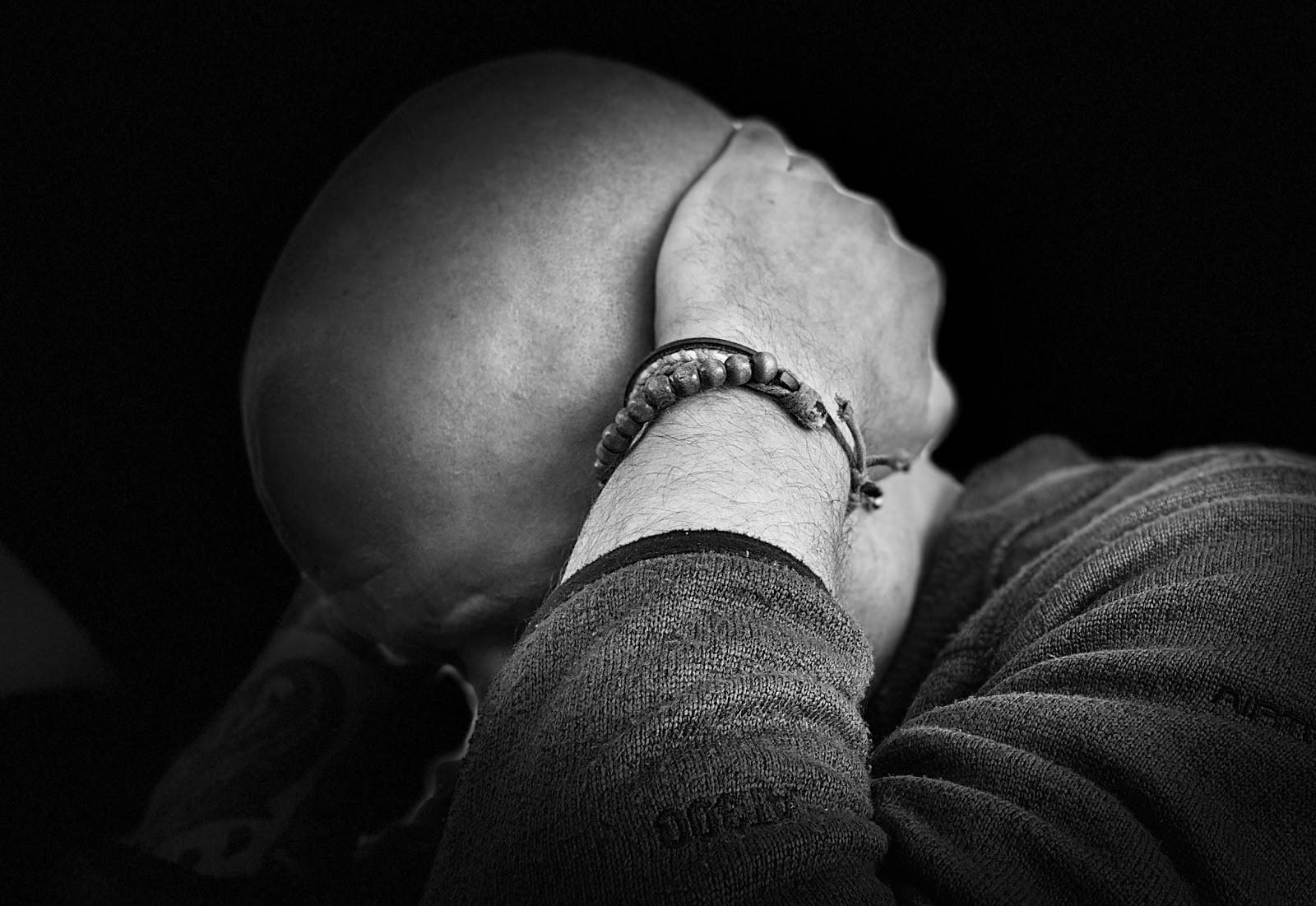 Person with head in hands