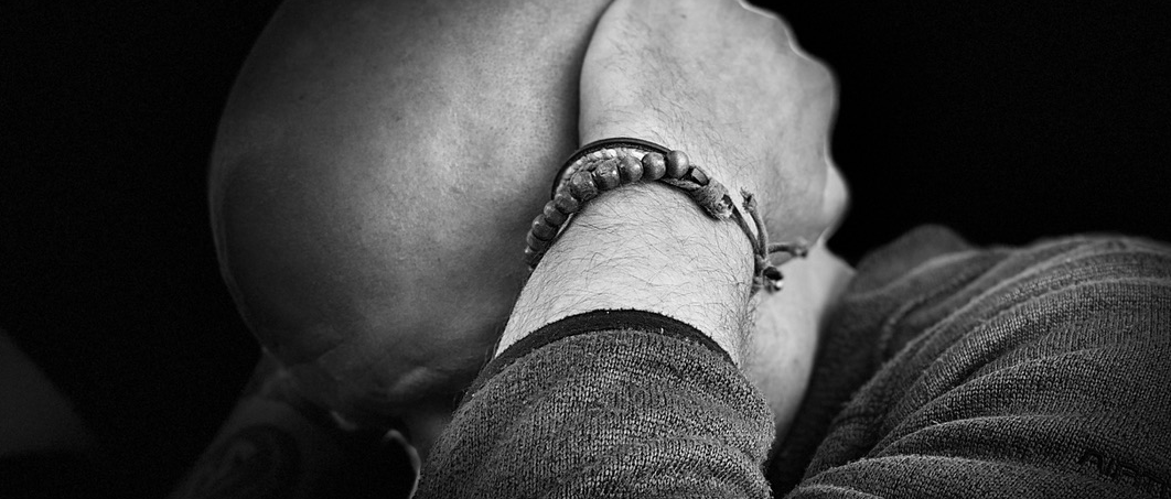 Person with head in hands