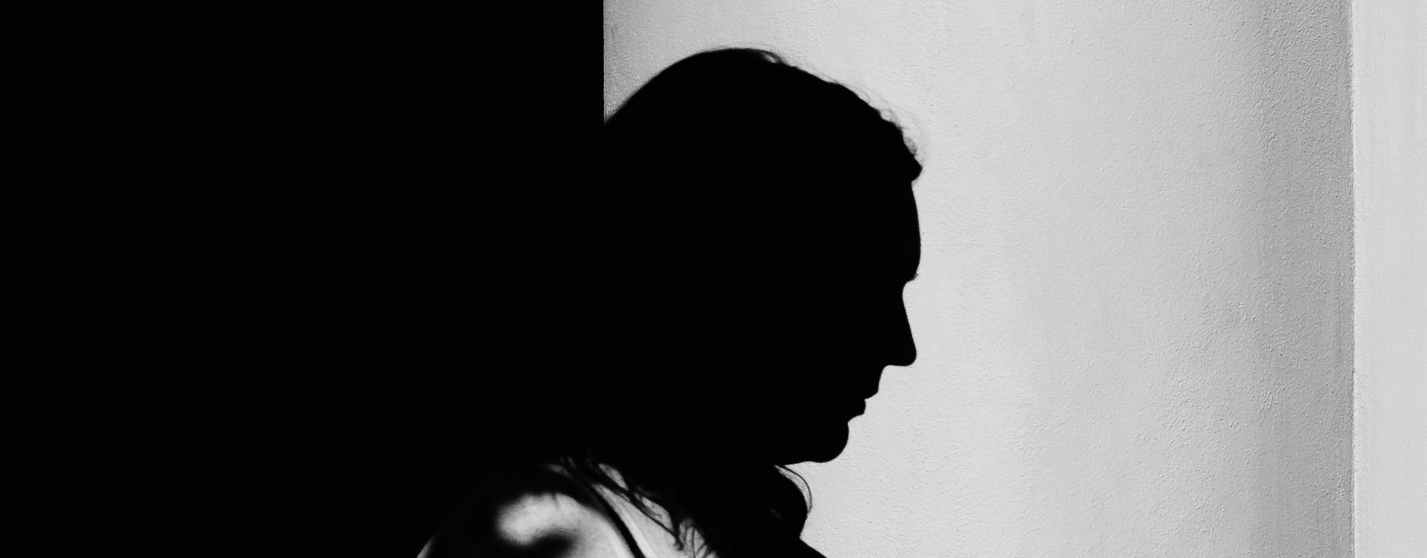 Silhouette of a person in the dark