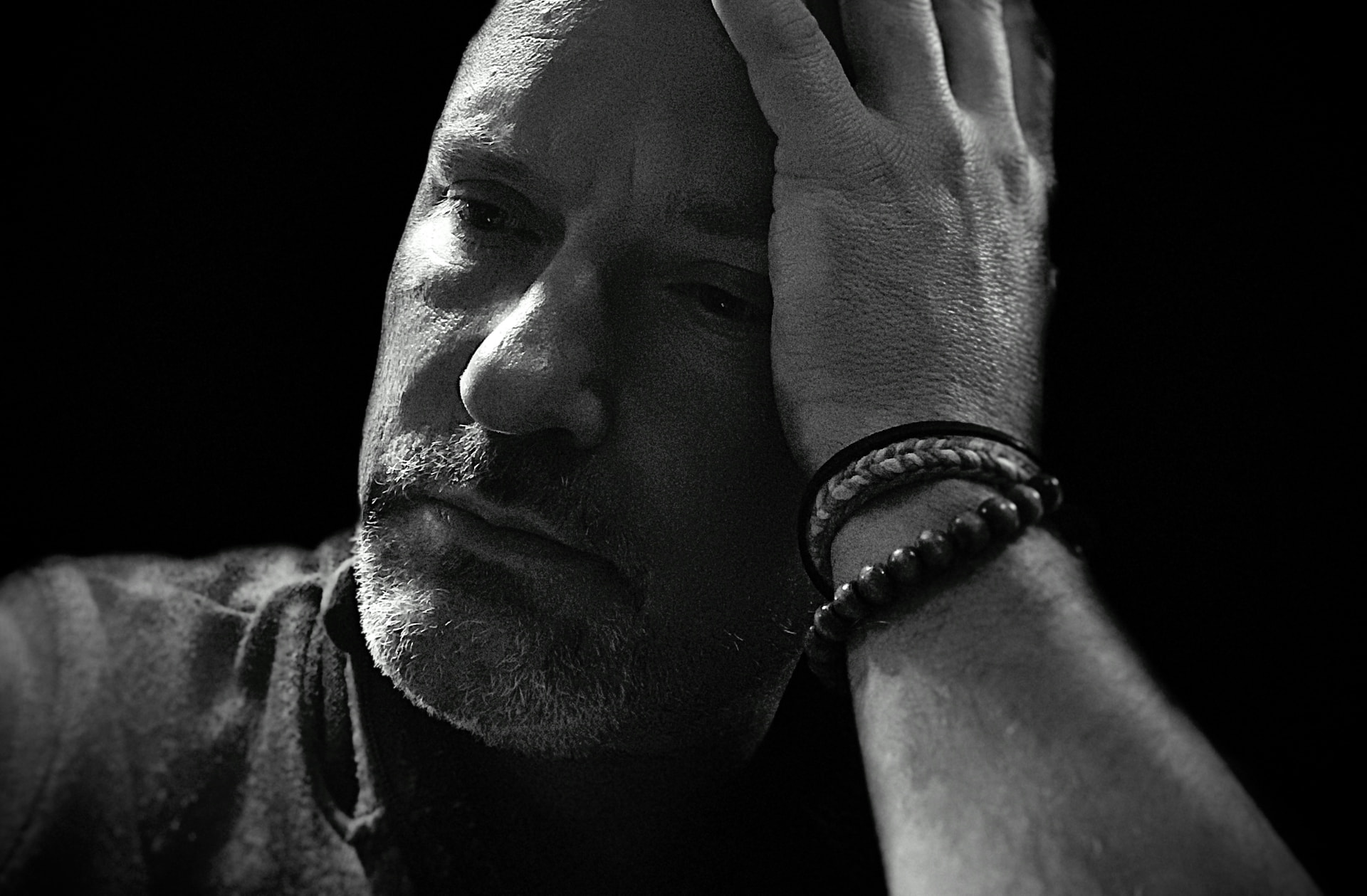 Self-portrait of Paul Fjelrad in low light