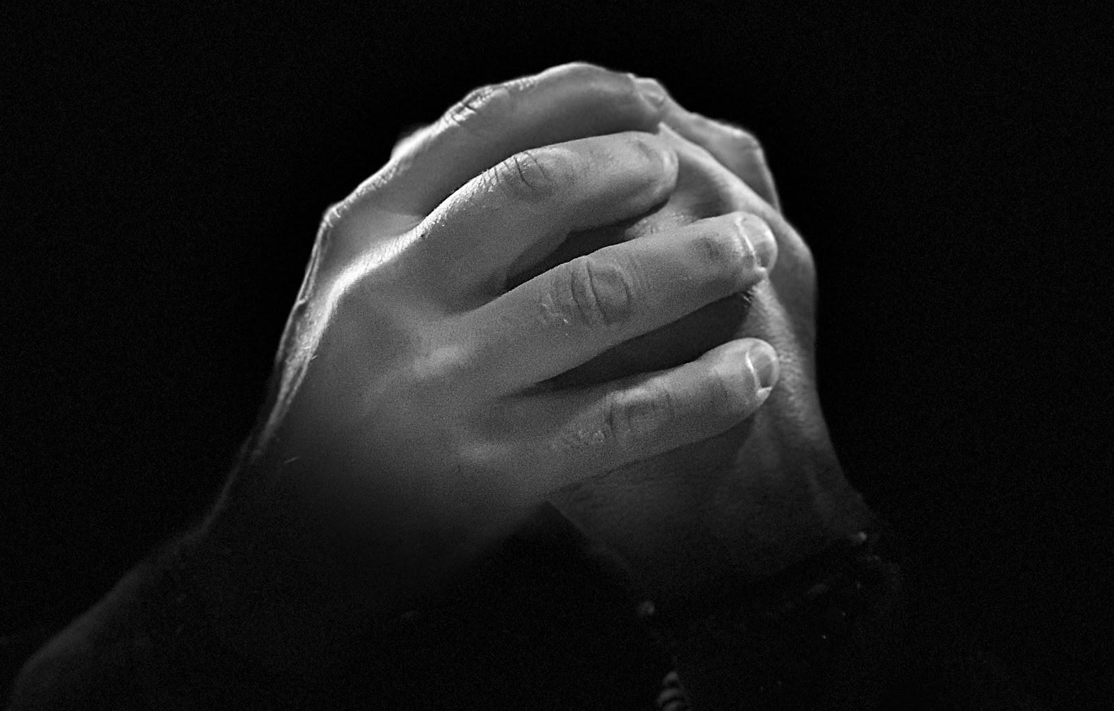 Hands clasped together